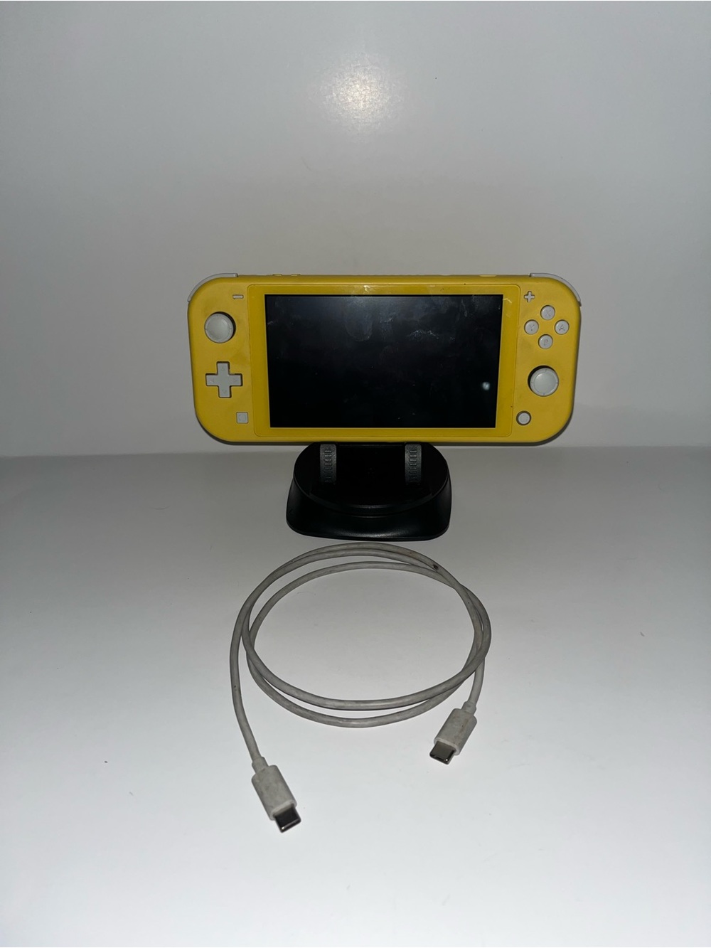 Yellow Nintendo switch light with charger